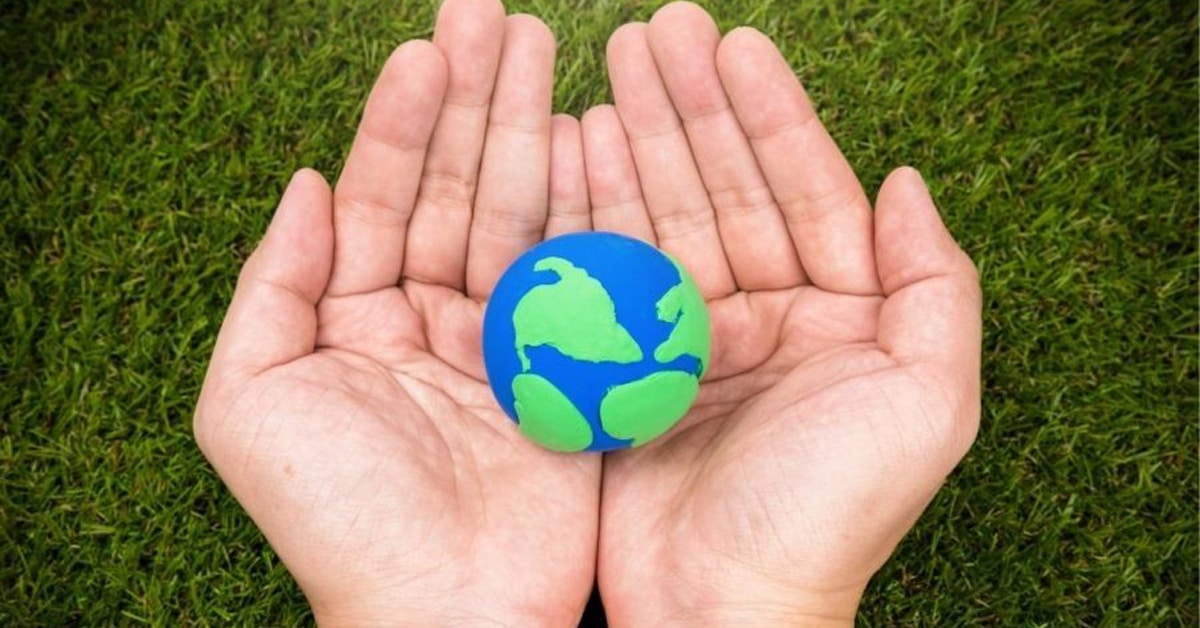 a hand holding a green ball