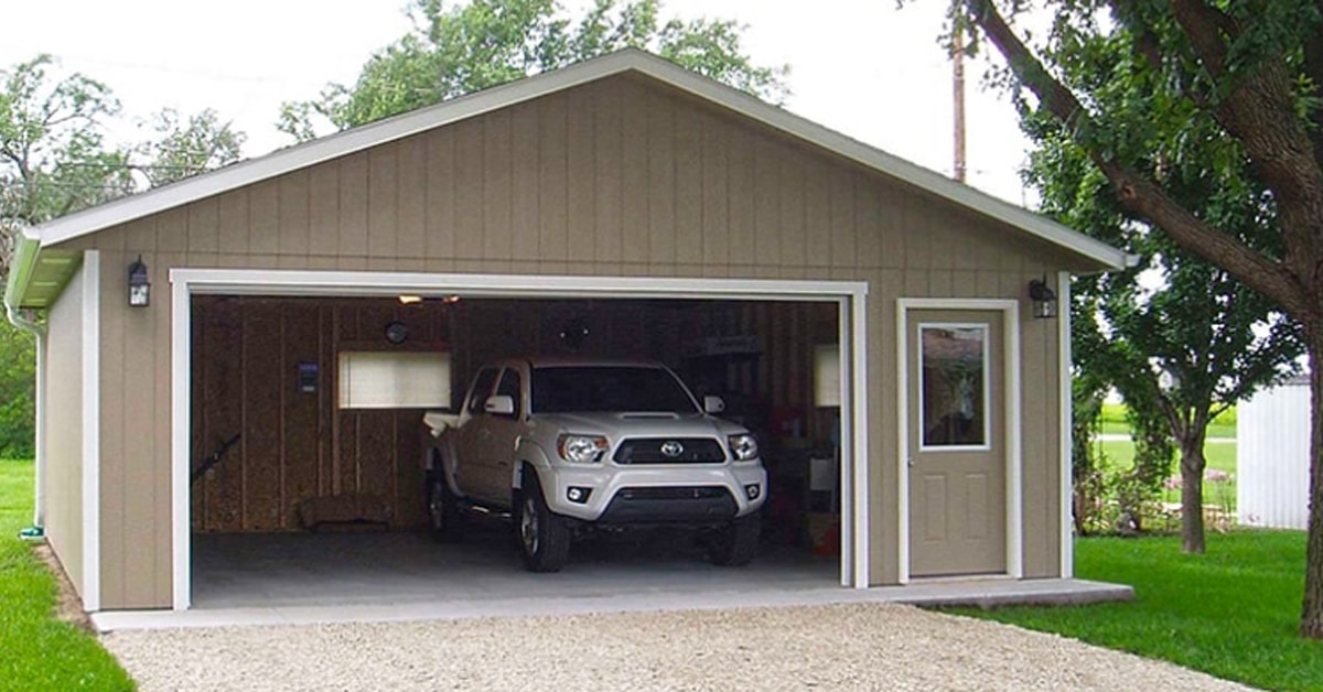 a large lawn in front of a house with HP Garage in the background