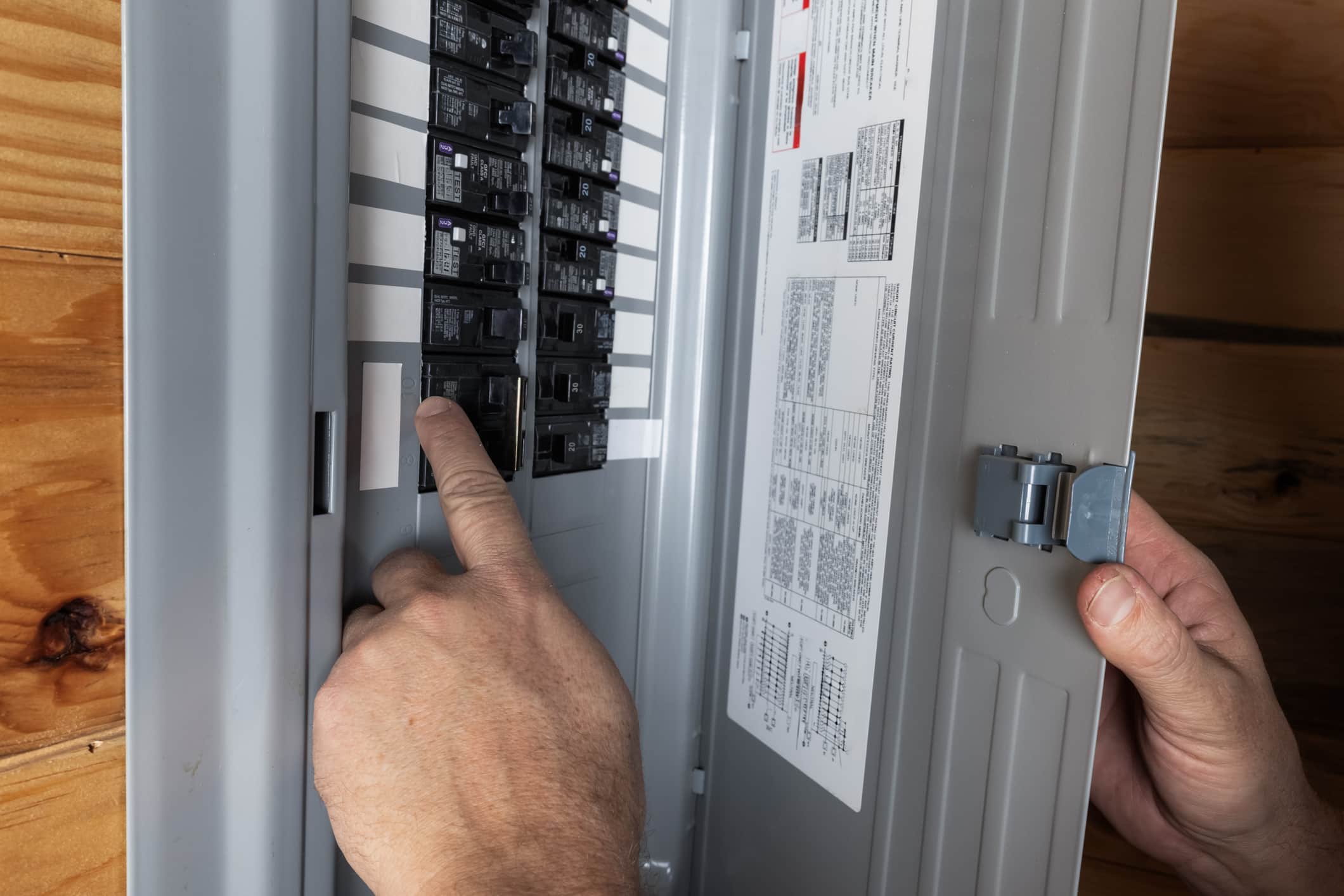 An Electric City electrician provides an electrical panel assessment to identify panel upgrades for safe EV charging.